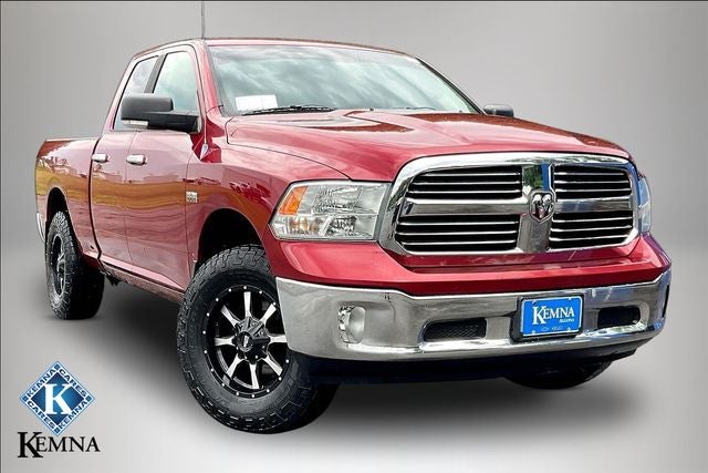 2014 RAM 1500 Big Horn in Maroon — front three-quarter view
