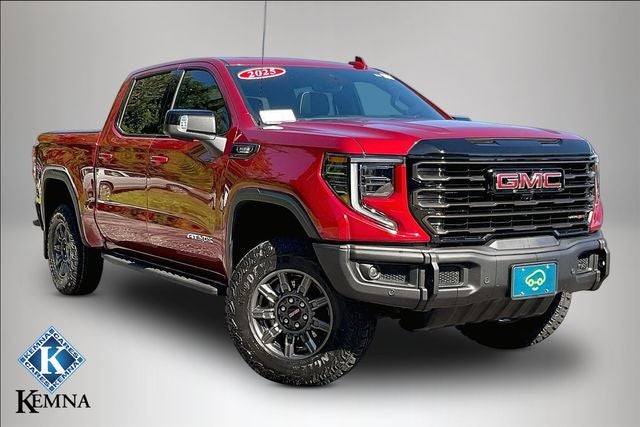 2025 GMC Sierra 1500 4WD Crew Cab Short Box AT4X in Volcanic Red Tintcoat — front three-quarter view